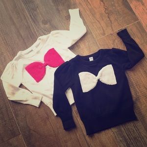 Two adorable bow sweaters
